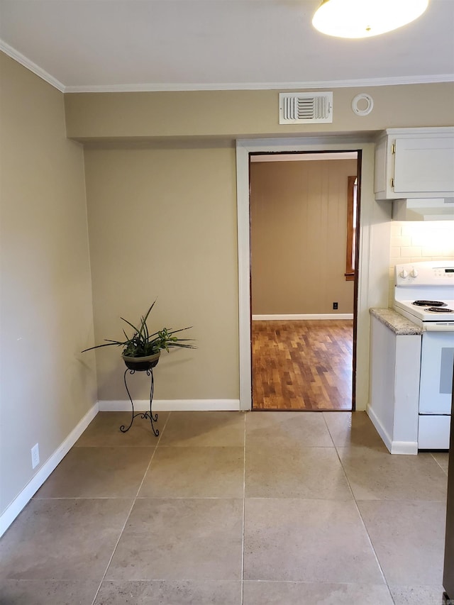 interior space with light hardwood / wood-style floors and crown molding