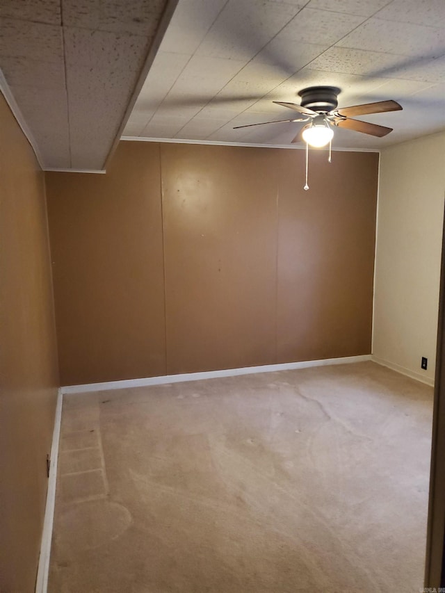 spare room with carpet flooring and ceiling fan