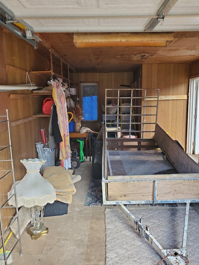 garage featuring wooden walls