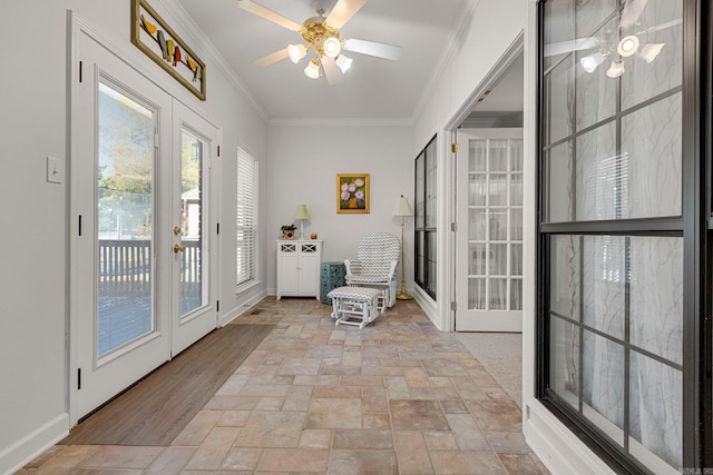 doorway featuring ceiling fan, ornamental molding, and french doors