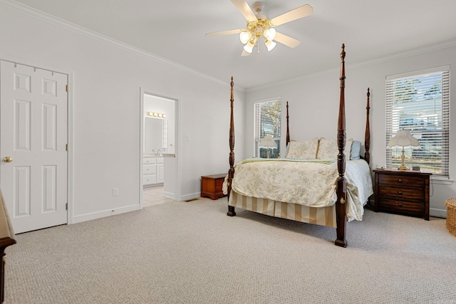 carpeted bedroom featuring ceiling fan, ensuite bath, ornamental molding, and multiple windows