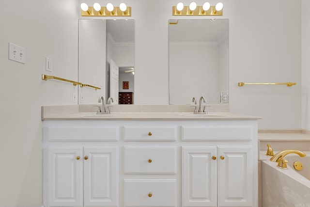 bathroom featuring a bath, vanity, and ornamental molding