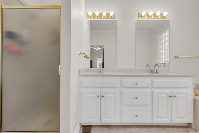 bathroom with walk in shower, tile patterned floors, vanity, and ornamental molding