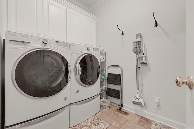 laundry room with cabinets, separate washer and dryer, and ornamental molding