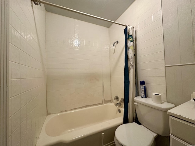 full bathroom with shower / tub combo with curtain, vanity, tile walls, and toilet