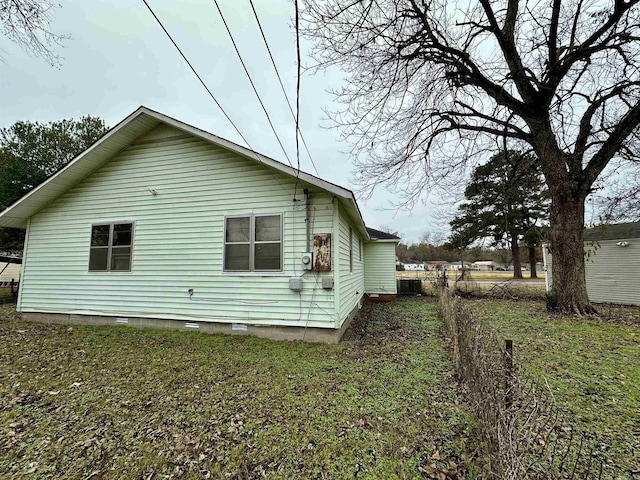 view of home's exterior featuring a lawn