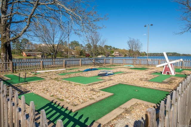 surrounding community featuring a water view