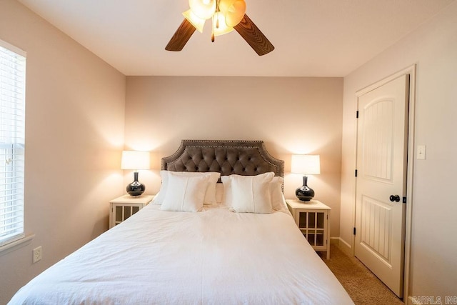 carpeted bedroom featuring ceiling fan