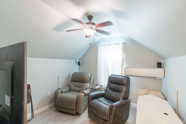 living area with ceiling fan, light hardwood / wood-style flooring, and vaulted ceiling