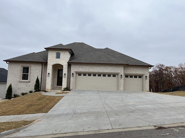 view of front of property with a garage