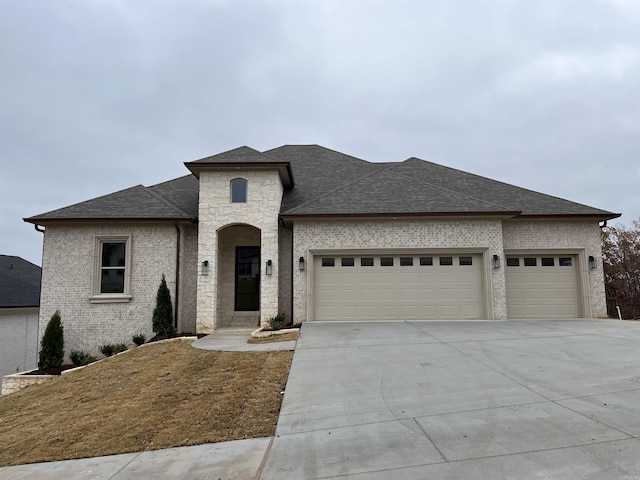 view of front of property with a garage