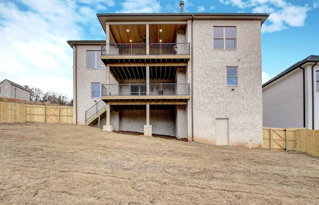 rear view of property featuring a balcony