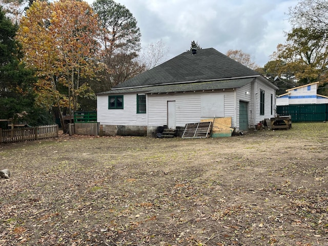 307 N 4th St, Benton, AR 71015 - rear view of property with entry steps and a shingled roof