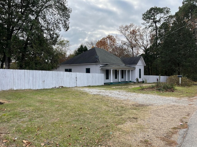 307 N 4th St, Benton, AR 71015 - view of home's exterior with driveway and a shingled roof