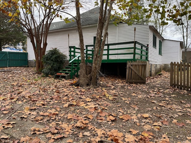 view of property exterior with a deck