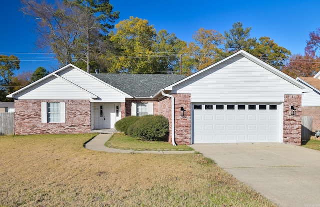 ranch-style house with a garage and a front lawn