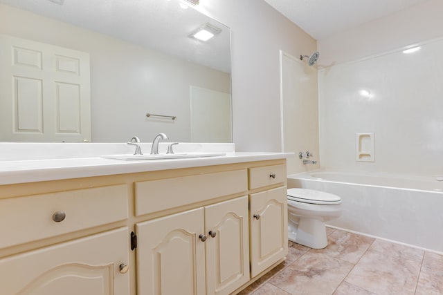 full bathroom with tile patterned flooring,  shower combination, a textured ceiling, toilet, and vanity