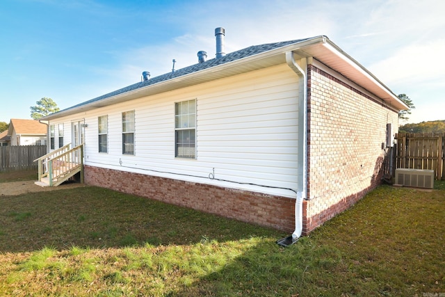 view of property exterior with a lawn