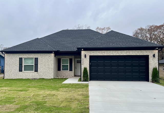 single story home with a front yard and a garage