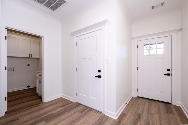 entryway featuring hardwood / wood-style floors and ornamental molding