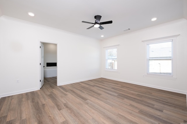 unfurnished room with ceiling fan, ornamental molding, and hardwood / wood-style flooring