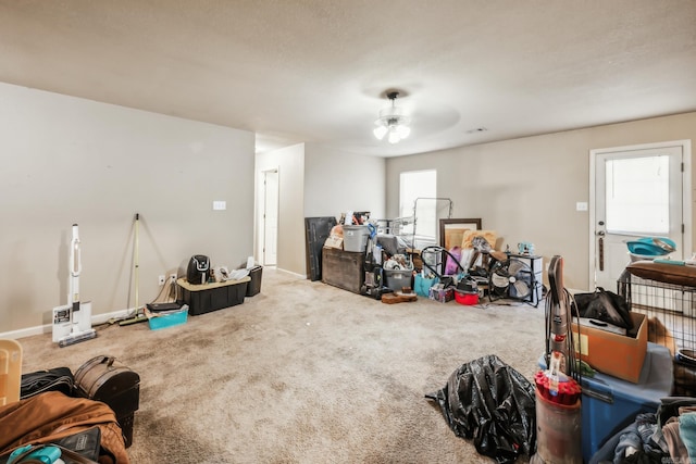 miscellaneous room featuring carpet flooring and ceiling fan