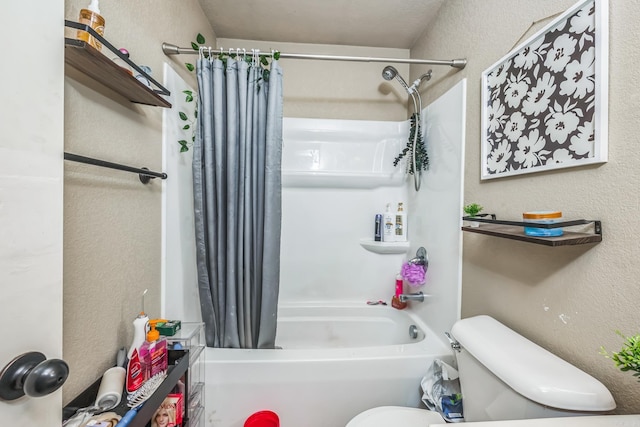 bathroom with shower / tub combo and toilet