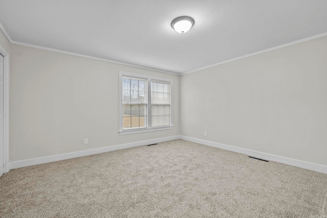 carpeted spare room with ornamental molding