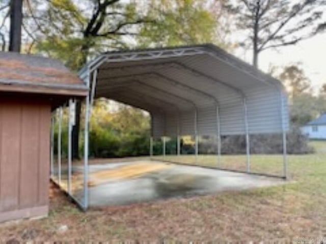 view of parking featuring a carport and a yard