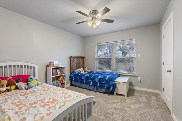 bedroom with light colored carpet and ceiling fan