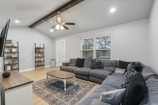 living room featuring vaulted ceiling with beams, ceiling fan, and hardwood / wood-style flooring