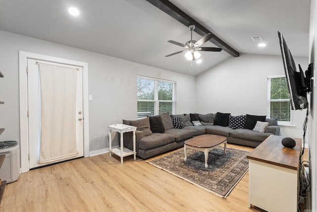 living room with light wood-type flooring, lofted ceiling with beams, and ceiling fan