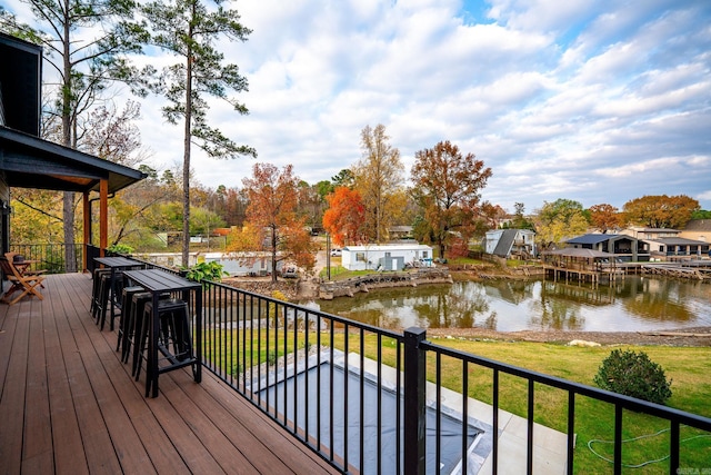 wooden deck with a water view