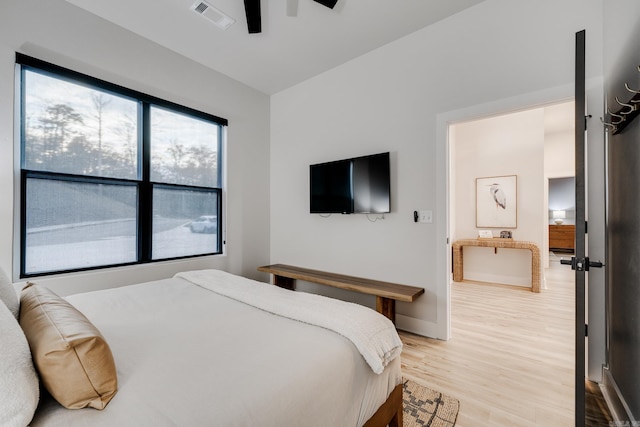 bedroom featuring ceiling fan and light hardwood / wood-style flooring