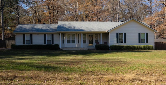 ranch-style home with a front lawn