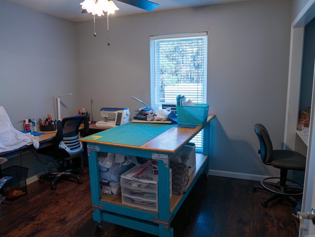 office with ceiling fan and dark wood-type flooring