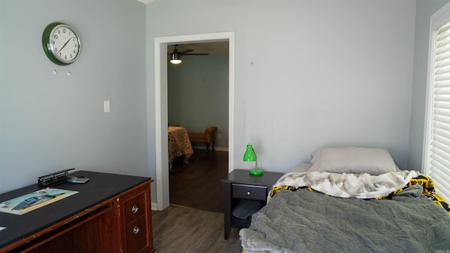 bedroom with dark wood-type flooring