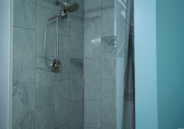 bathroom with tiled shower