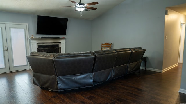 living room featuring dark hardwood / wood-style flooring, ceiling fan, french doors, and lofted ceiling