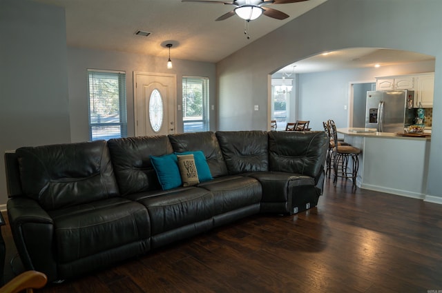 living room with dark hardwood / wood-style floors and ceiling fan