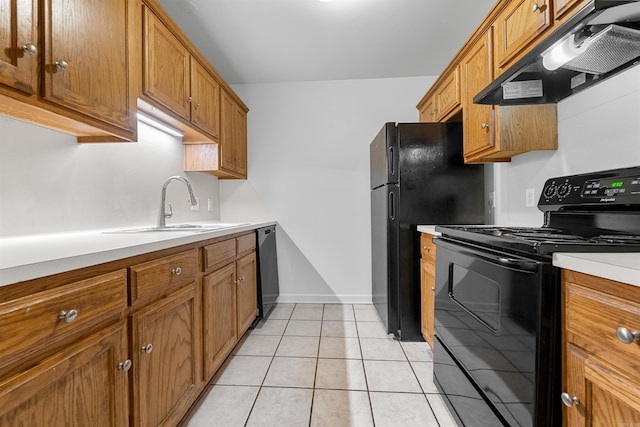 kitchen featuring light tile patterned flooring, sink, and black appliances