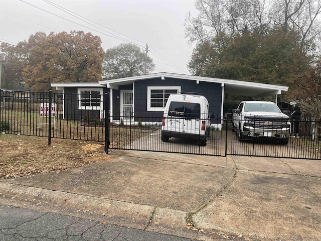 view of front of property featuring a carport