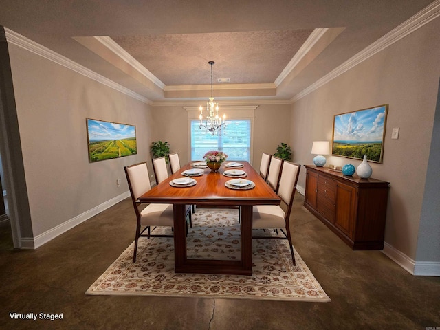 dining area with a chandelier, a tray ceiling, and ornamental molding