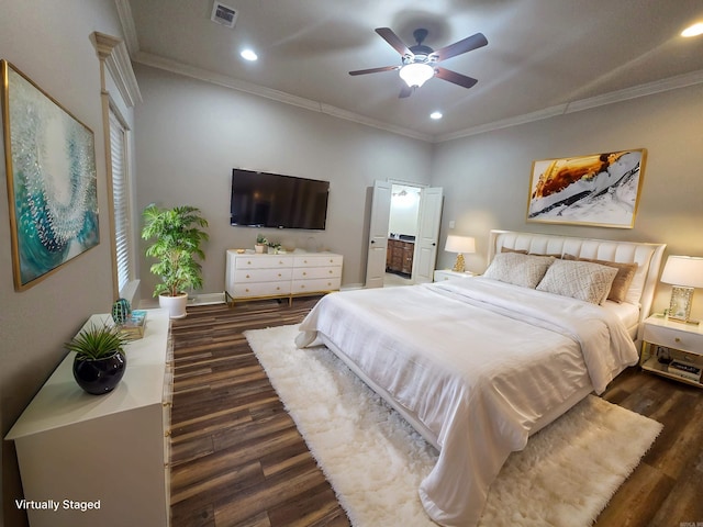 bedroom with ceiling fan, ornamental molding, and dark wood-type flooring