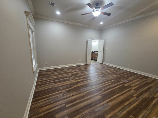 empty room featuring ceiling fan, dark hardwood / wood-style floors, and ornamental molding