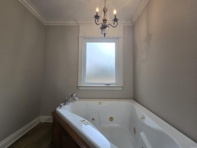 bathroom featuring a bathing tub, crown molding, and a chandelier