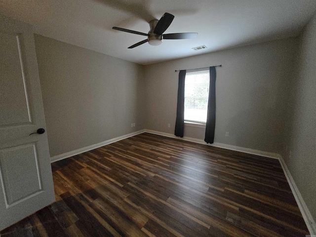 unfurnished room featuring ceiling fan and dark wood-type flooring