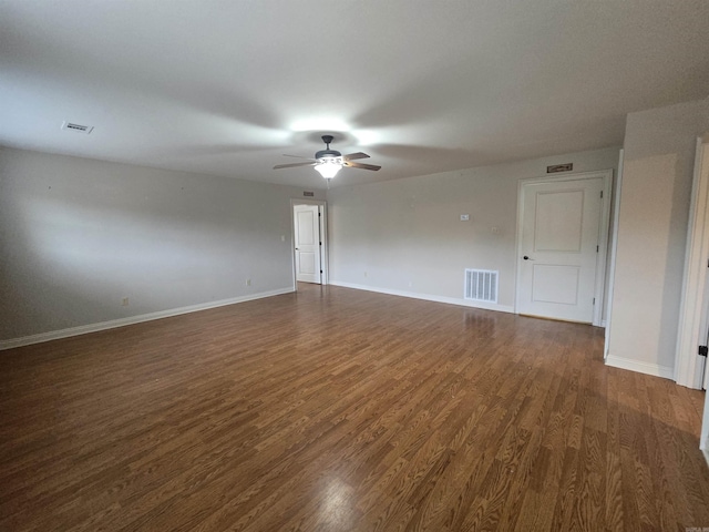 unfurnished room with ceiling fan and dark wood-type flooring