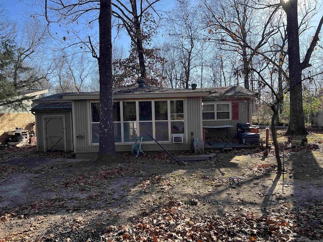 rear view of house with a sunroom