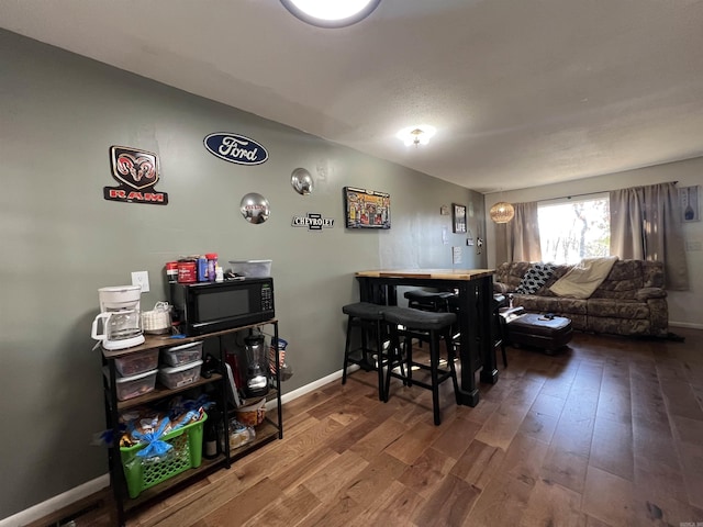 dining room with hardwood / wood-style flooring